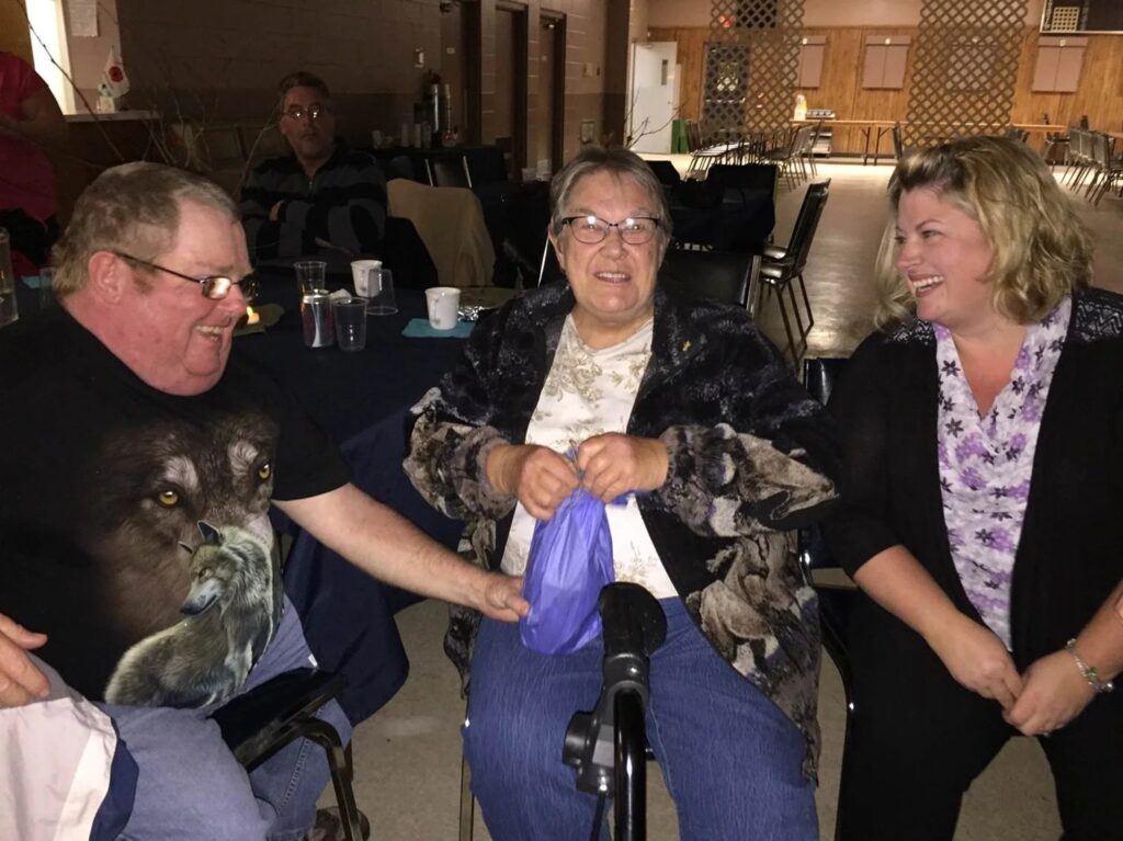 People interacting and smiling together in a social setting