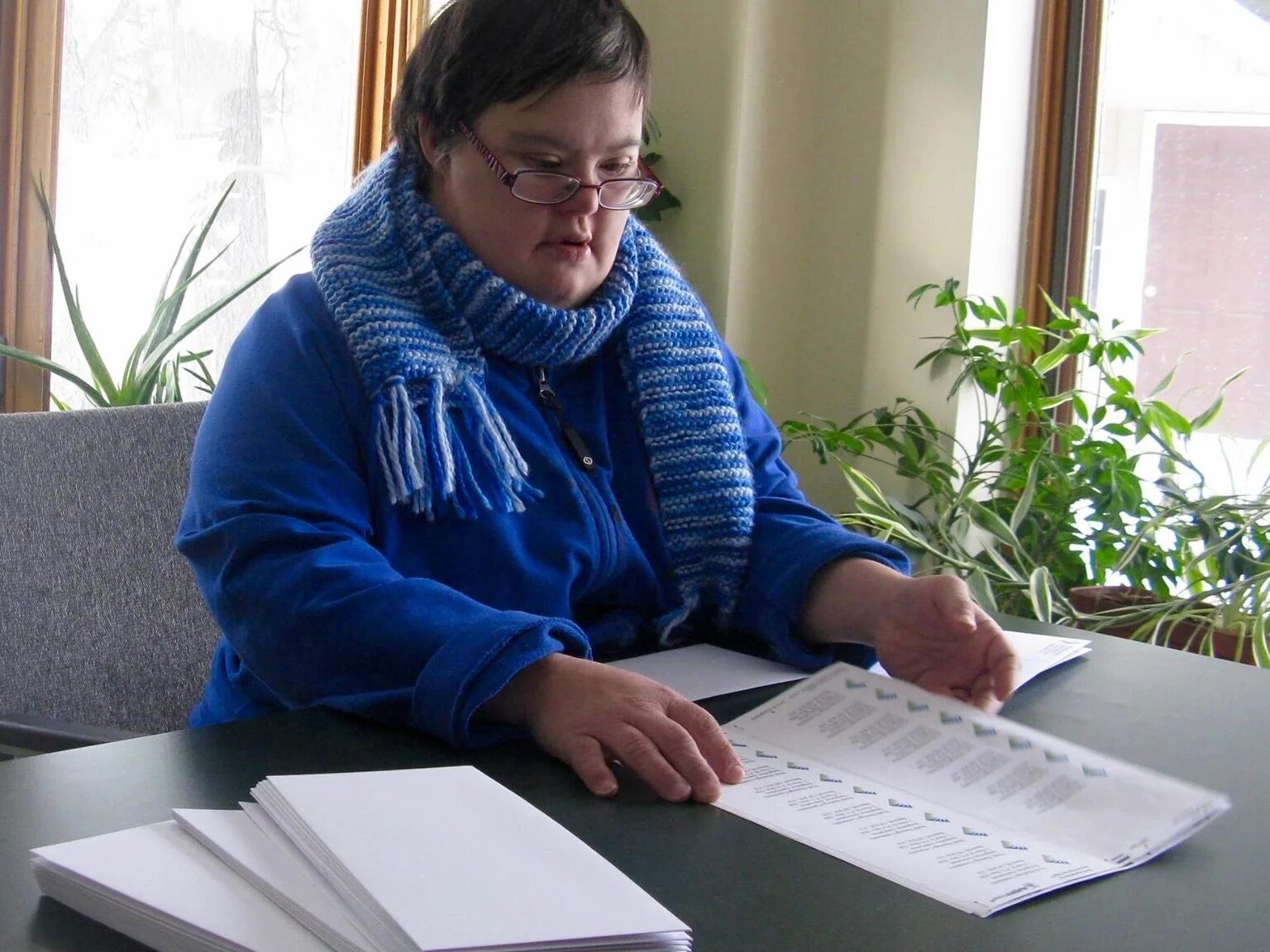Person working at a desk doing paperwork